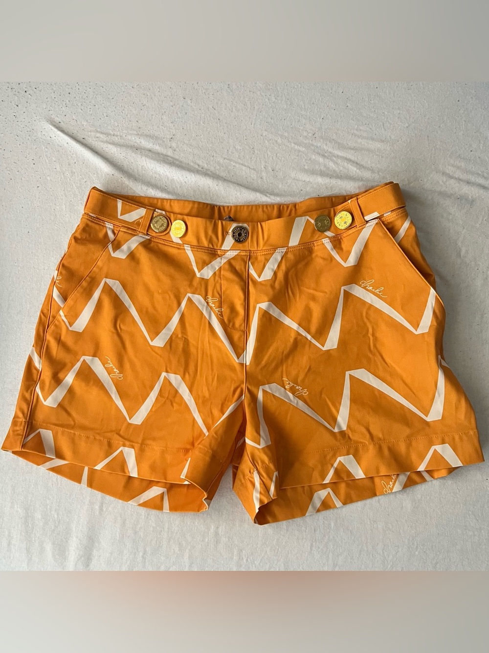 Stylish Orange Chevron Swim Shorts with Gold Hardware
